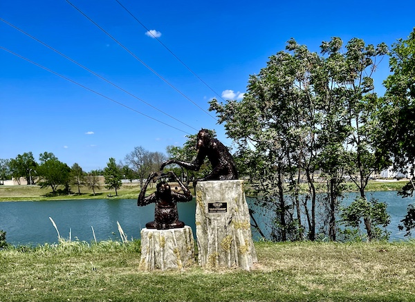 Pair of bronze chimpanzee sculptures at Indian Springs Park Waco Texas