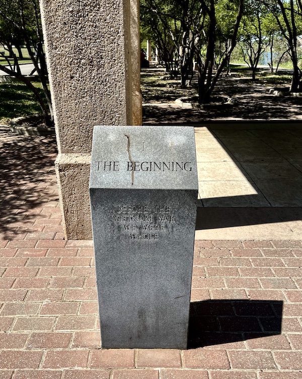 Gray stone monument to the beginning of the Vietnam War at Indian Springs Park Waco Texas