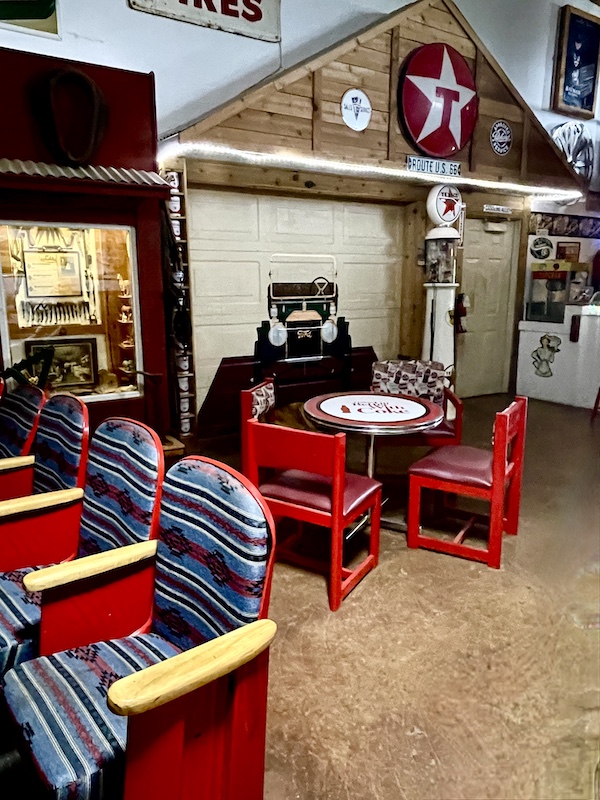 Movie theater seats and tables with chairs in the party room that's available for rent at John's Place Arcadia Oklahoma