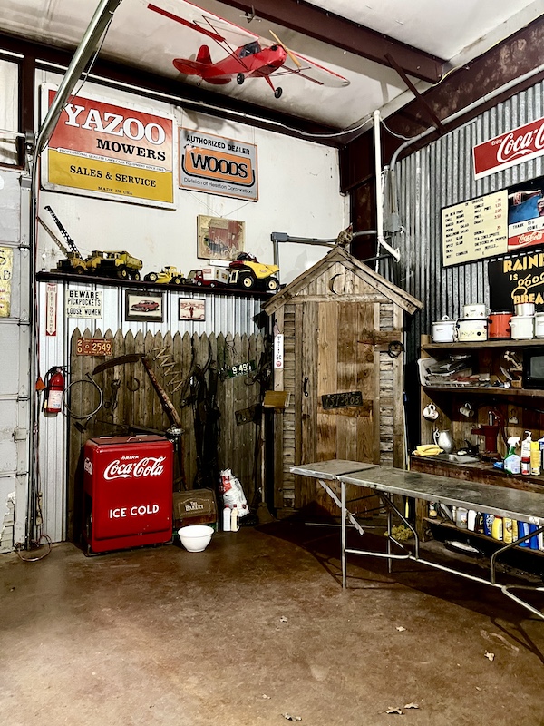 Old wood outhouse and other oddities on display at John's Place Arcadia Oklahoma