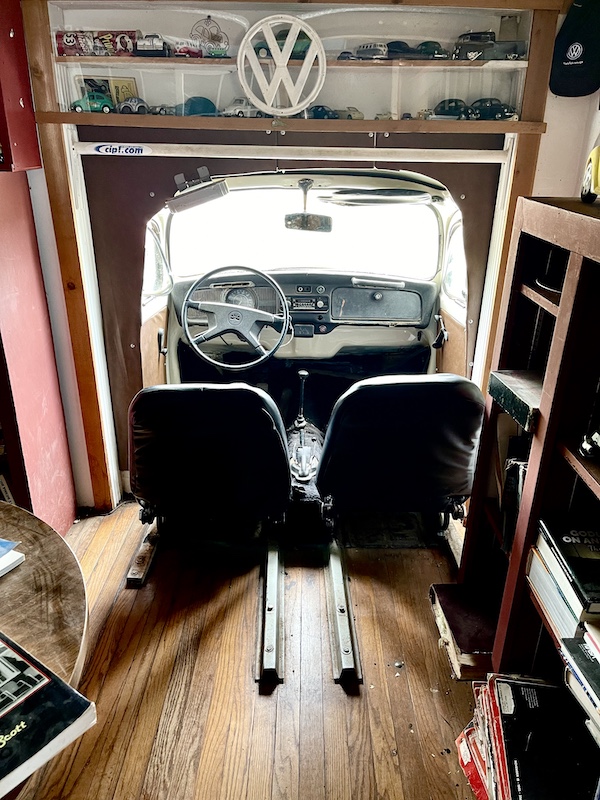Half of a VW Beetle is available to sit in inside John's Place Arcadia Oklahoma. The front is outside the building