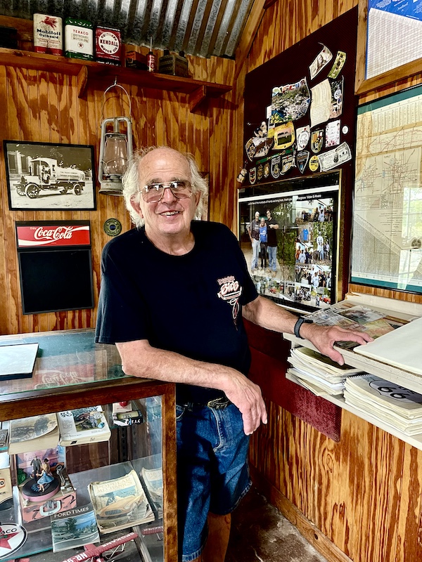 Man with silver hair and black t-shirt is owner of John's Place Arcadia Oklahoma