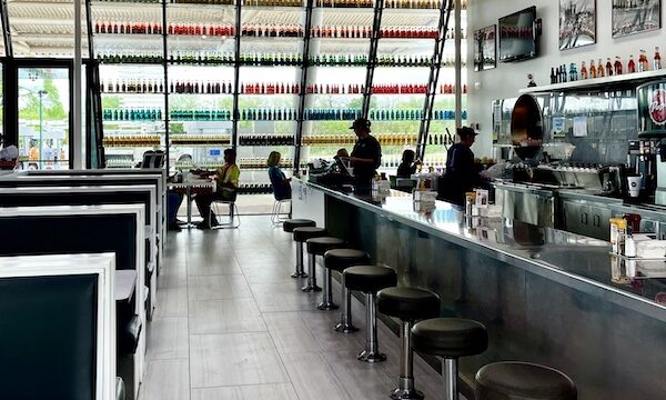 Diner counter with stools and wall of sodas at Pops Route 66 Arcadia Oklahoma