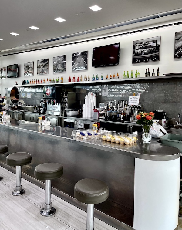 Diner counter with bottles and cupcakes at Pops Route 66 Arcadia Oklahoma