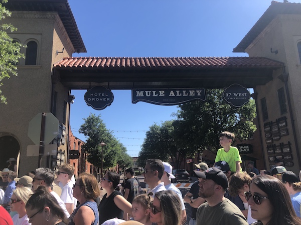 Crowd of people waiting for the cattle drive to start at The Stockyards Fort Worth Texas
