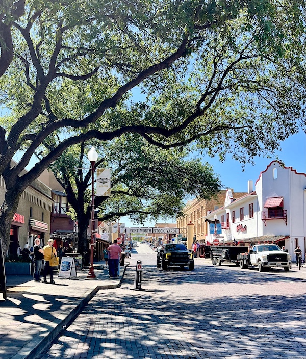 Cobblestone street lined with shops and restaurants at The Stockyards Fort Worth Texas