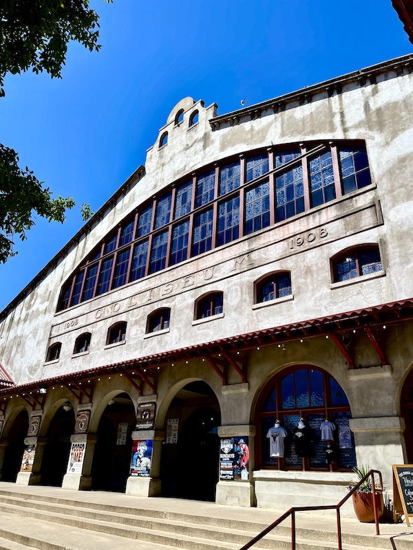 Large white building houses an indoor rodeo at The Stockyards Fort Worth Texas